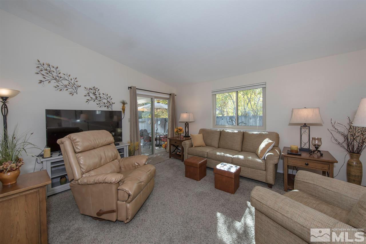 2264 Escalera Way Reno, NV 89523 - Photo 7 of 25 a living room with furniture and a fireplace