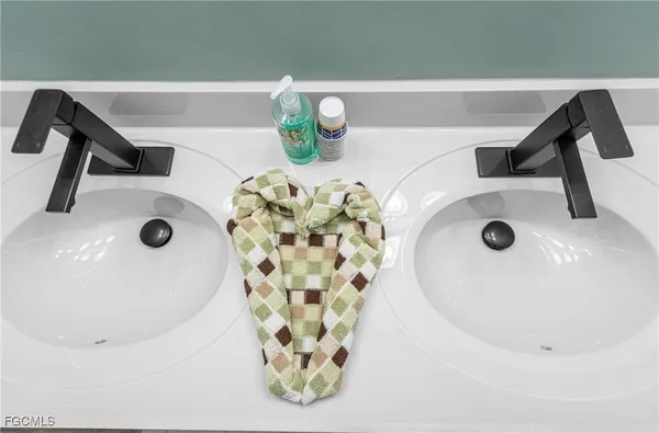 a bathroom with a sink and mirror
