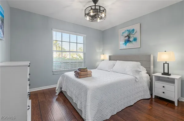 a bedroom with bed and a window