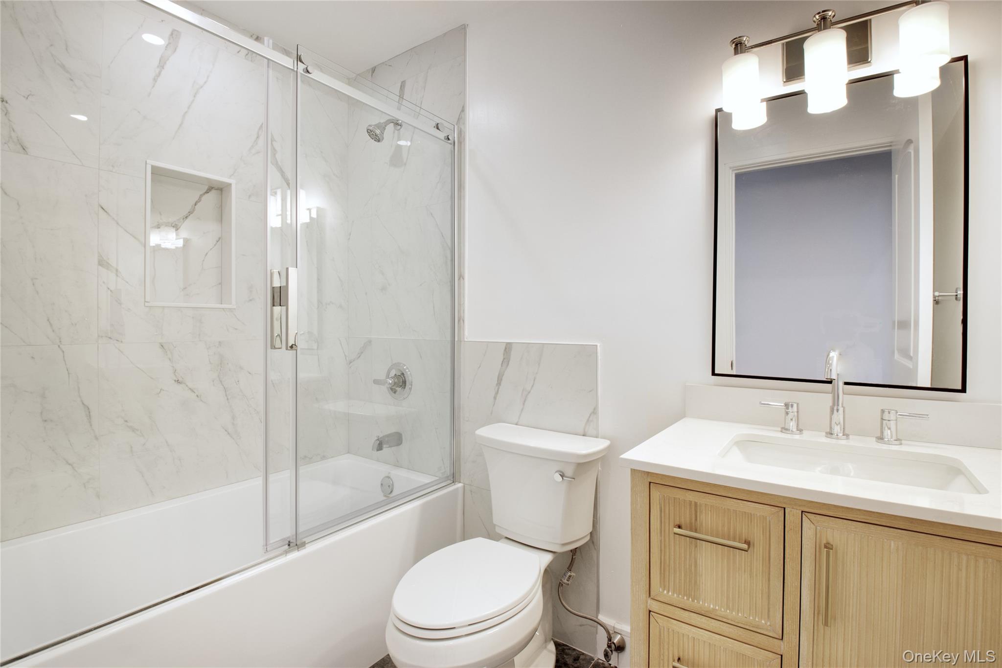 30 Kirkwood Road, Unit B Port Washington, NY 11050 - Photo 21 of 36 a bathroom with a sink toilet and shower