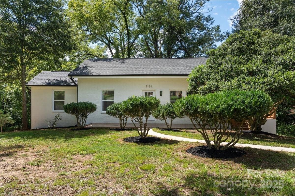3156 Long Shoals Road Lincolnton, NC 28092 - Photo 2 of 21 a view of a patio with a table and chairs and potted plants