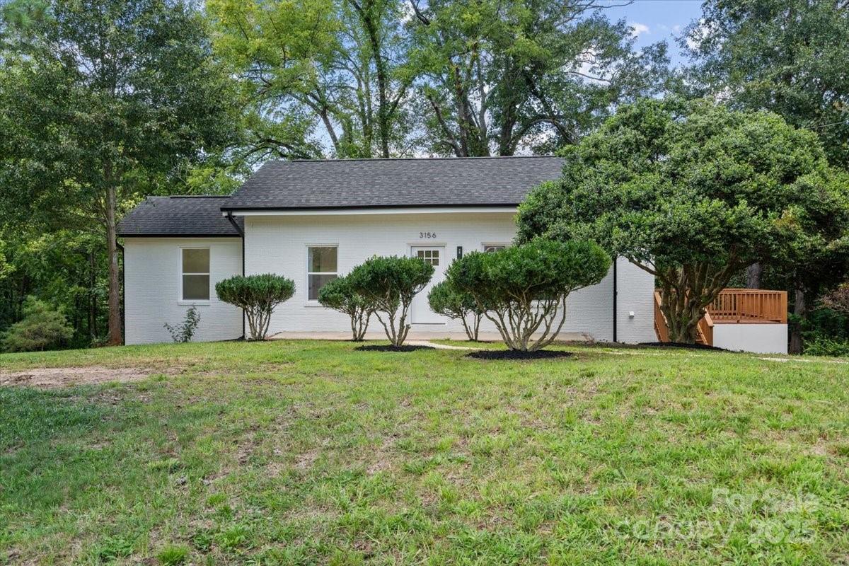 3156 Long Shoals Road Lincolnton, NC 28092 - Photo 3 of 21 a front view of a house with a yard and garage