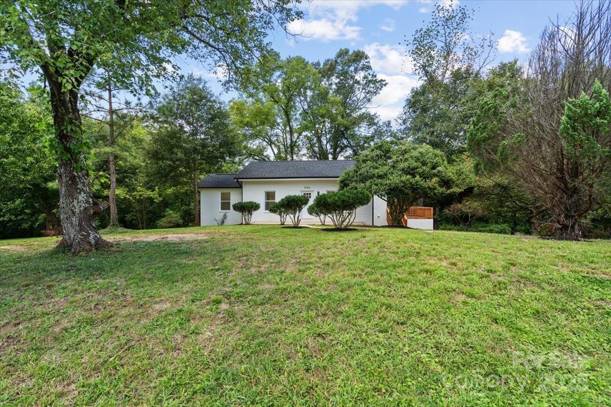 3156 Long Shoals Road Lincolnton, NC 28092 - Photo 4 of 21 a front view of a house with a yard