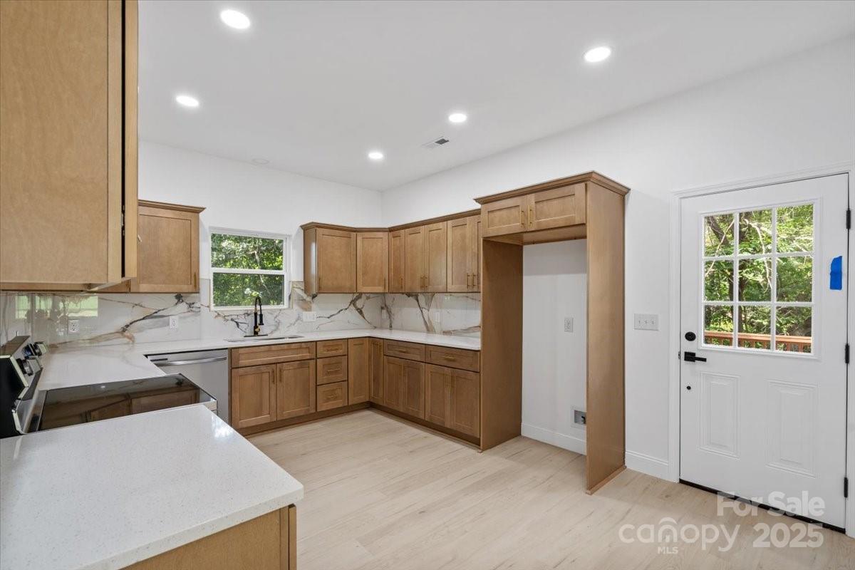3156 Long Shoals Road Lincolnton, NC 28092 - Photo 10 of 21 a kitchen that has a sink and a stove in it