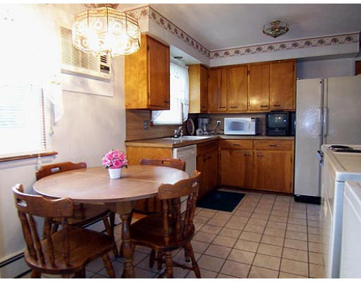 370 Morgan Road West Springfield, MA 01089 - Photo 2 of 10 a kitchen with a sink a refrigerator and wooden cabinets