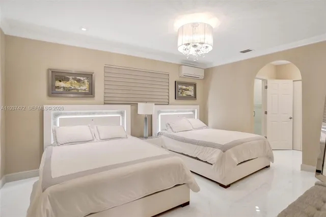 a bedroom with bed and a window