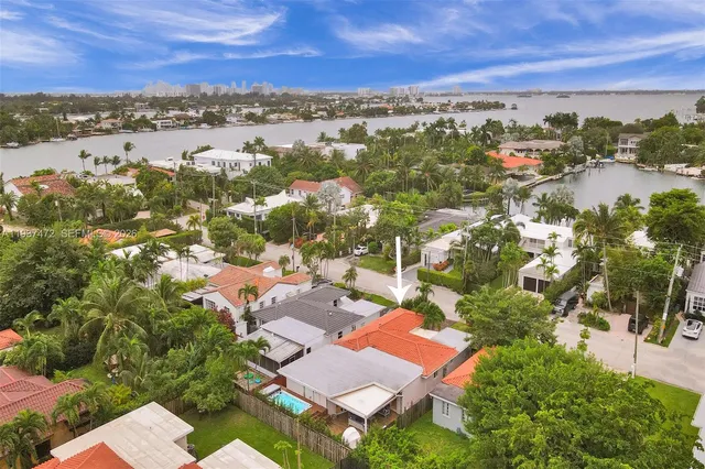 an aerial view of residential building with green space