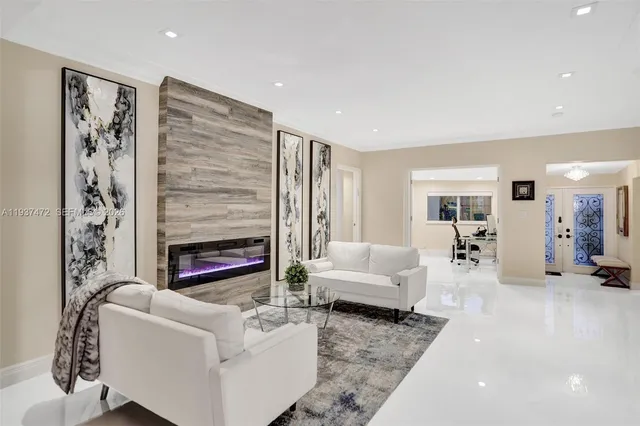 a living room with furniture and a fireplace