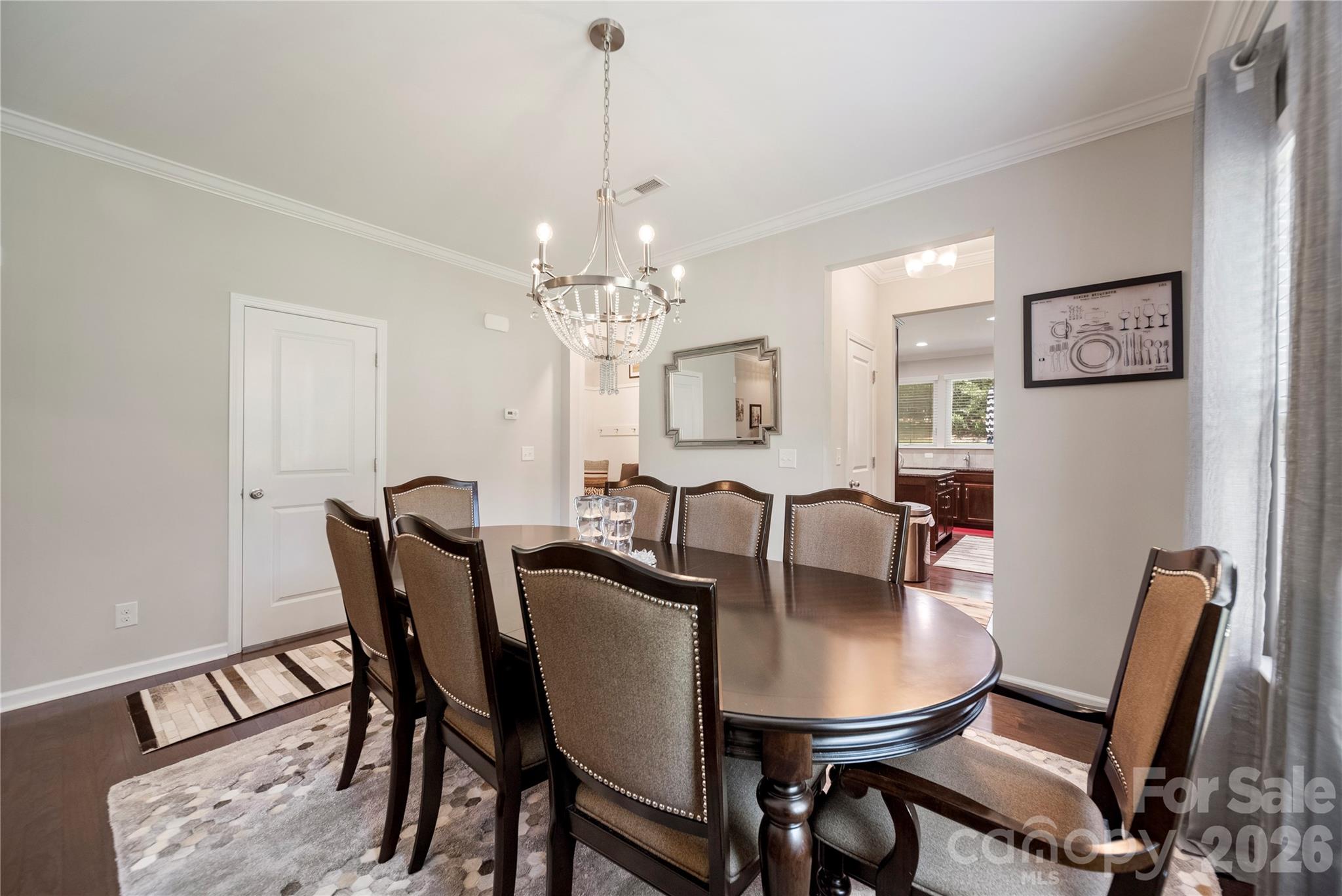 8122 Mossy Rock Road Waxhaw, NC 28173 - Photo 10 of 28 a view of a dining room with furniture and wooden floor