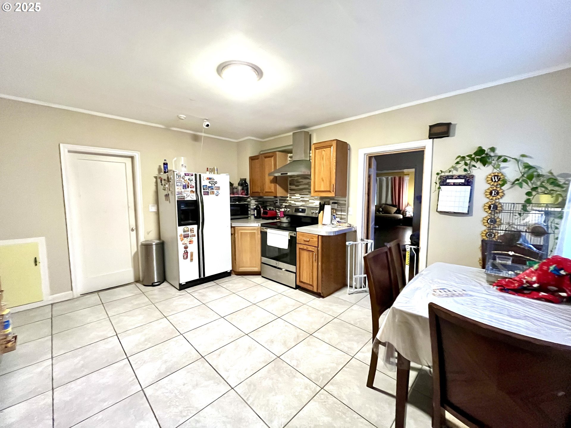 385 Southeast Twp Road Canby, OR 97013 - Photo 6 of 30 a kitchen with stainless steel appliances kitchen island granite countertop a refrigerator and cabinets