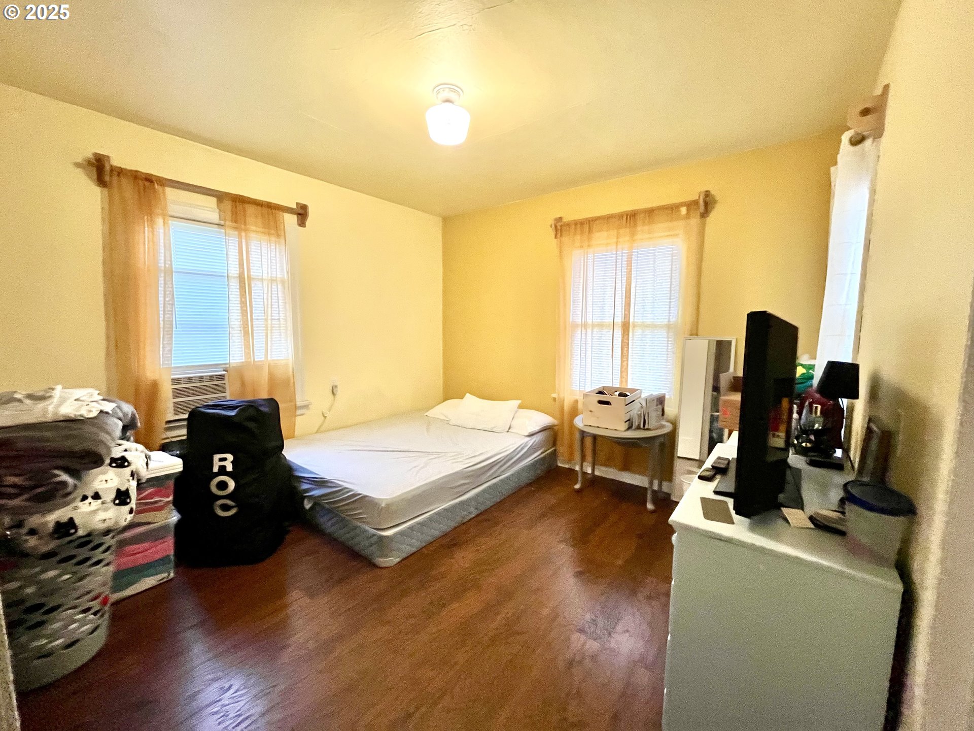 385 Southeast Twp Road Canby, OR 97013 - Photo 9 of 30 a bedroom with a bed and wooden floor