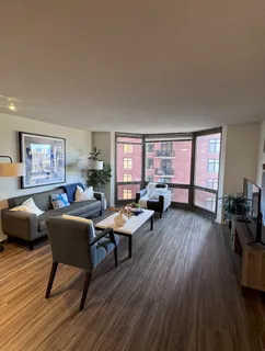 a view of a hallway and wooden floor