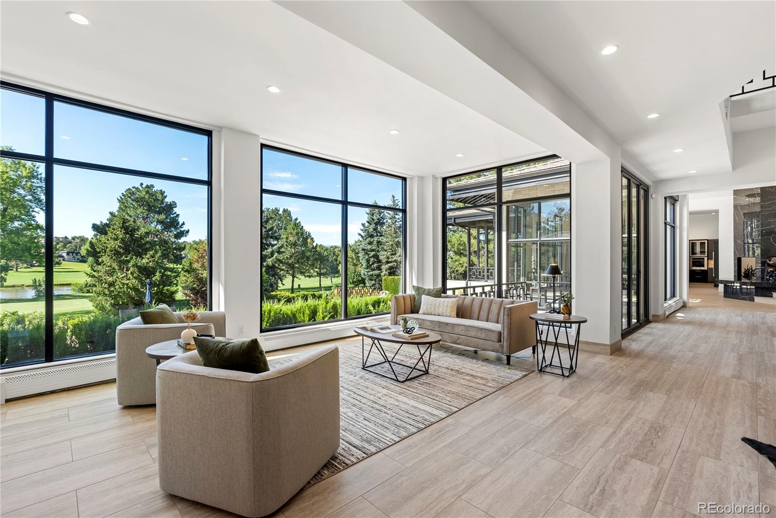 3962 South Chase Way Denver, CO 80235 - Photo 11 of 40 a living room with furniture and a large window