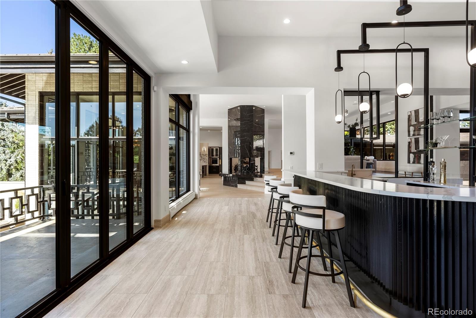 3962 South Chase Way Denver, CO 80235 - Photo 12 of 40 a view of a hallway with furniture and window