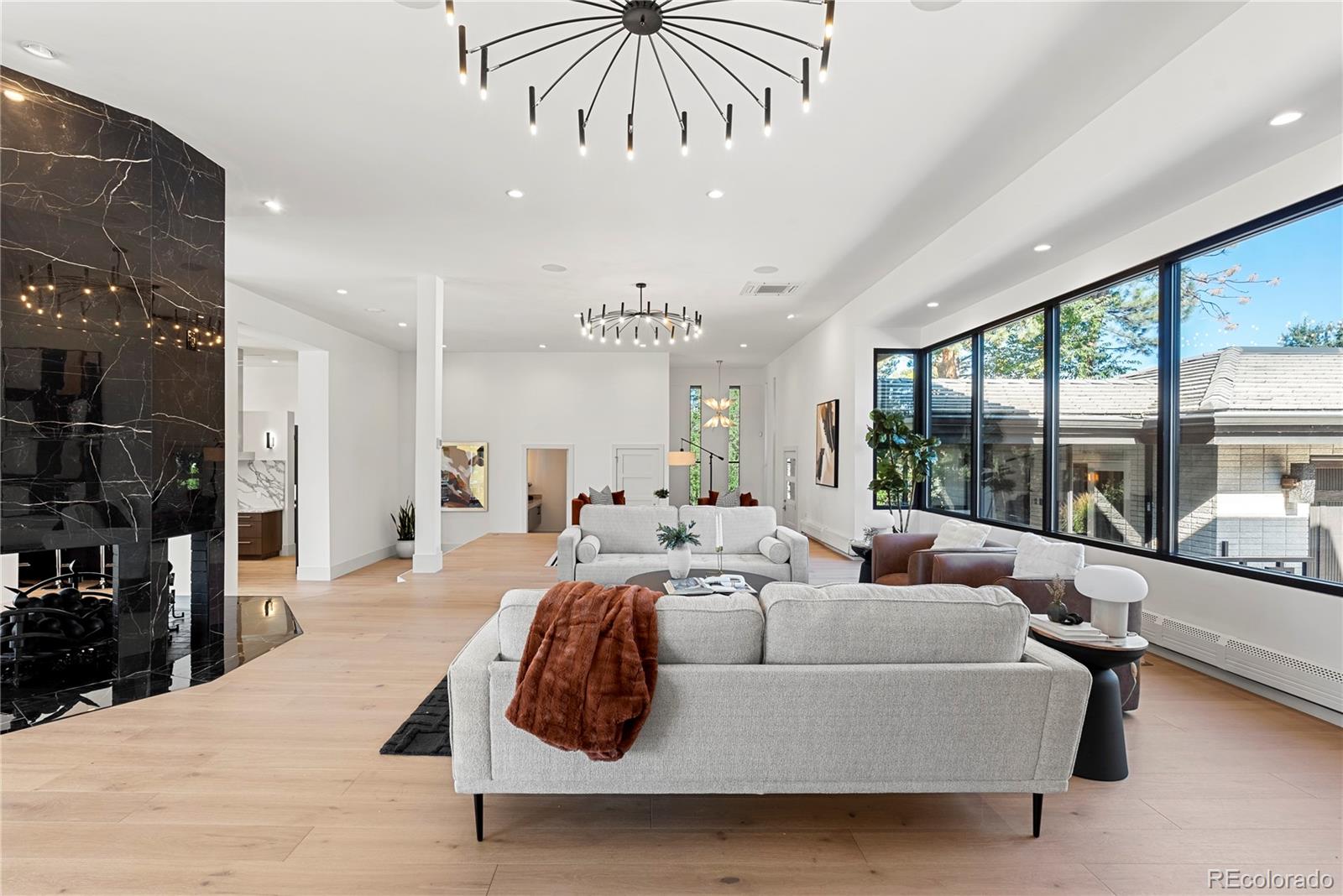 3962 South Chase Way Denver, CO 80235 - Photo 13 of 40 a living room with furniture and a large window
