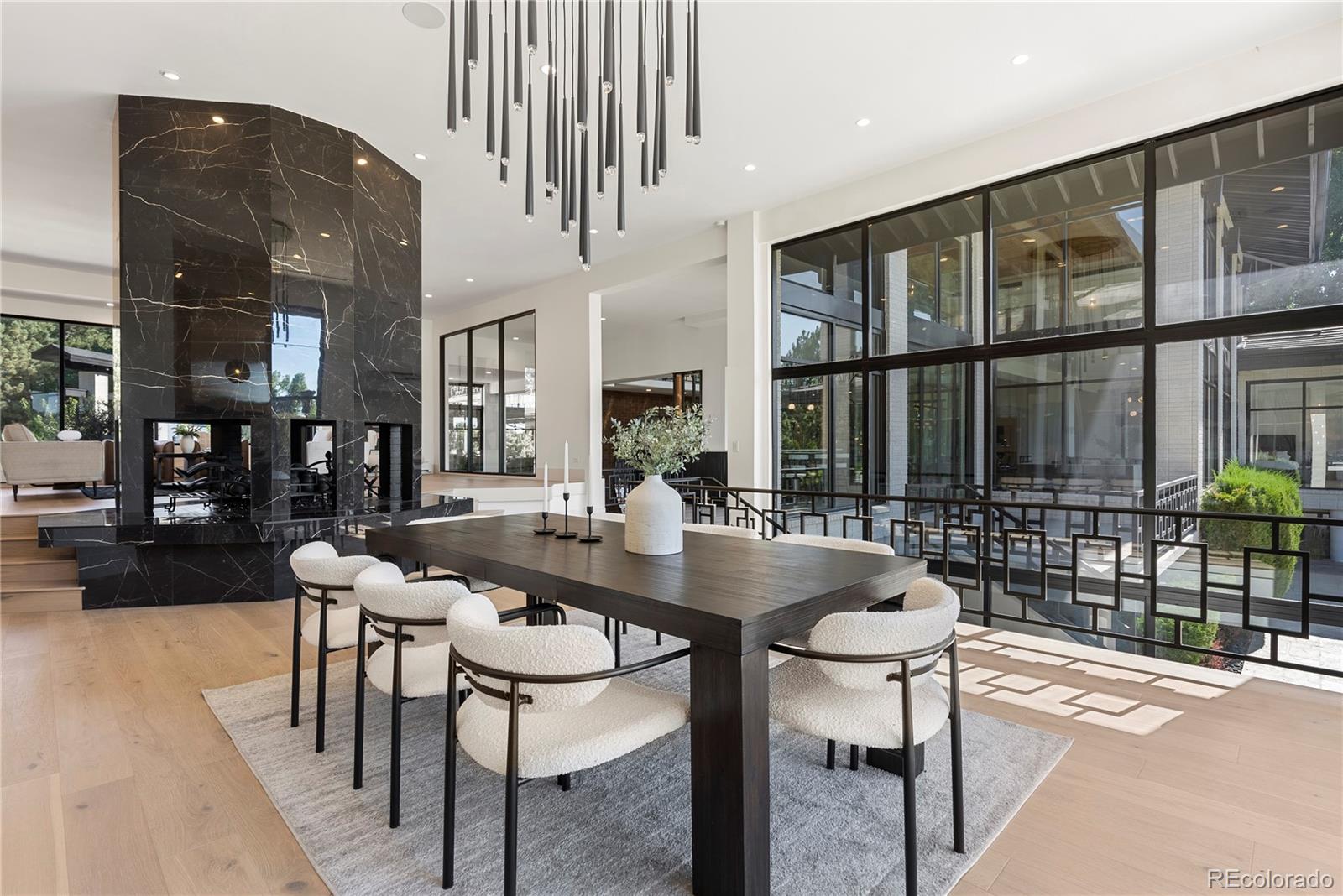 3962 South Chase Way Denver, CO 80235 - Photo 16 of 40 a dining room with furniture and window