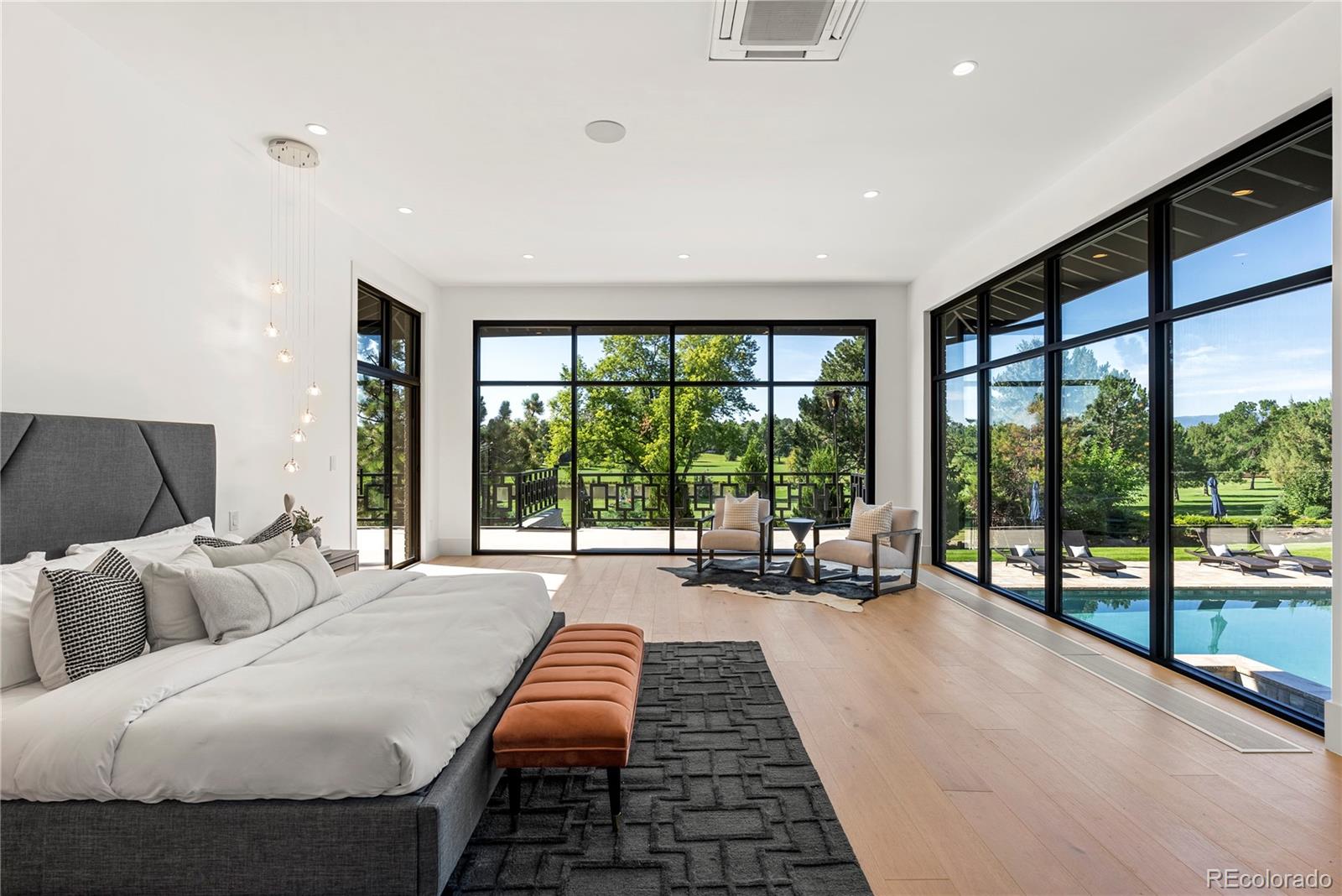 3962 South Chase Way Denver, CO 80235 - Photo 26 of 40 a bedroom with furniture and a large window