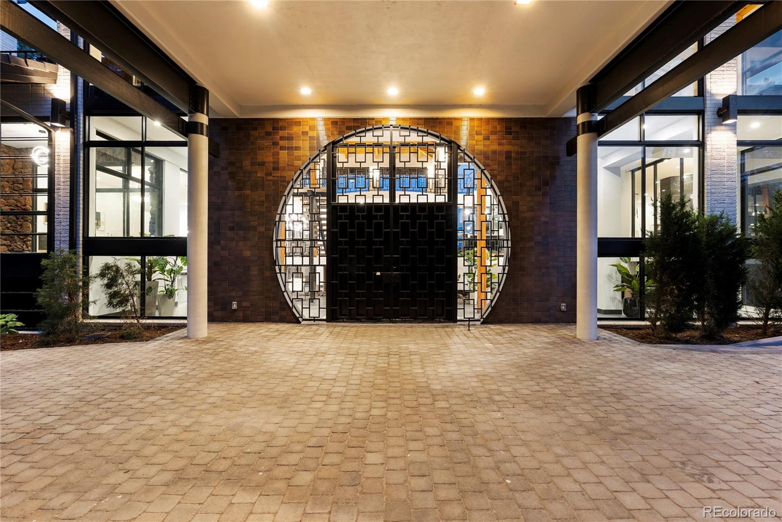 3962 South Chase Way Denver, CO 80235 - Photo 3 of 40 an empty room with a fireplace and windows