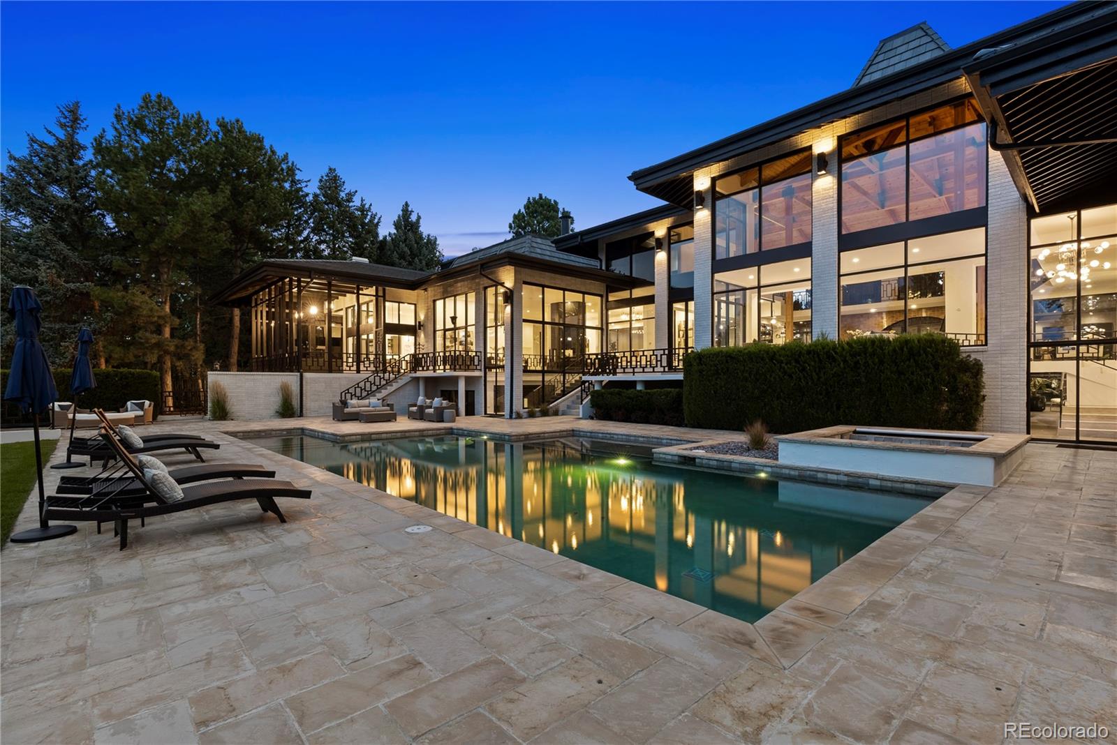 3962 South Chase Way Denver, CO 80235 - Photo 38 of 40 a view of a patio with swimming pool table and chairs