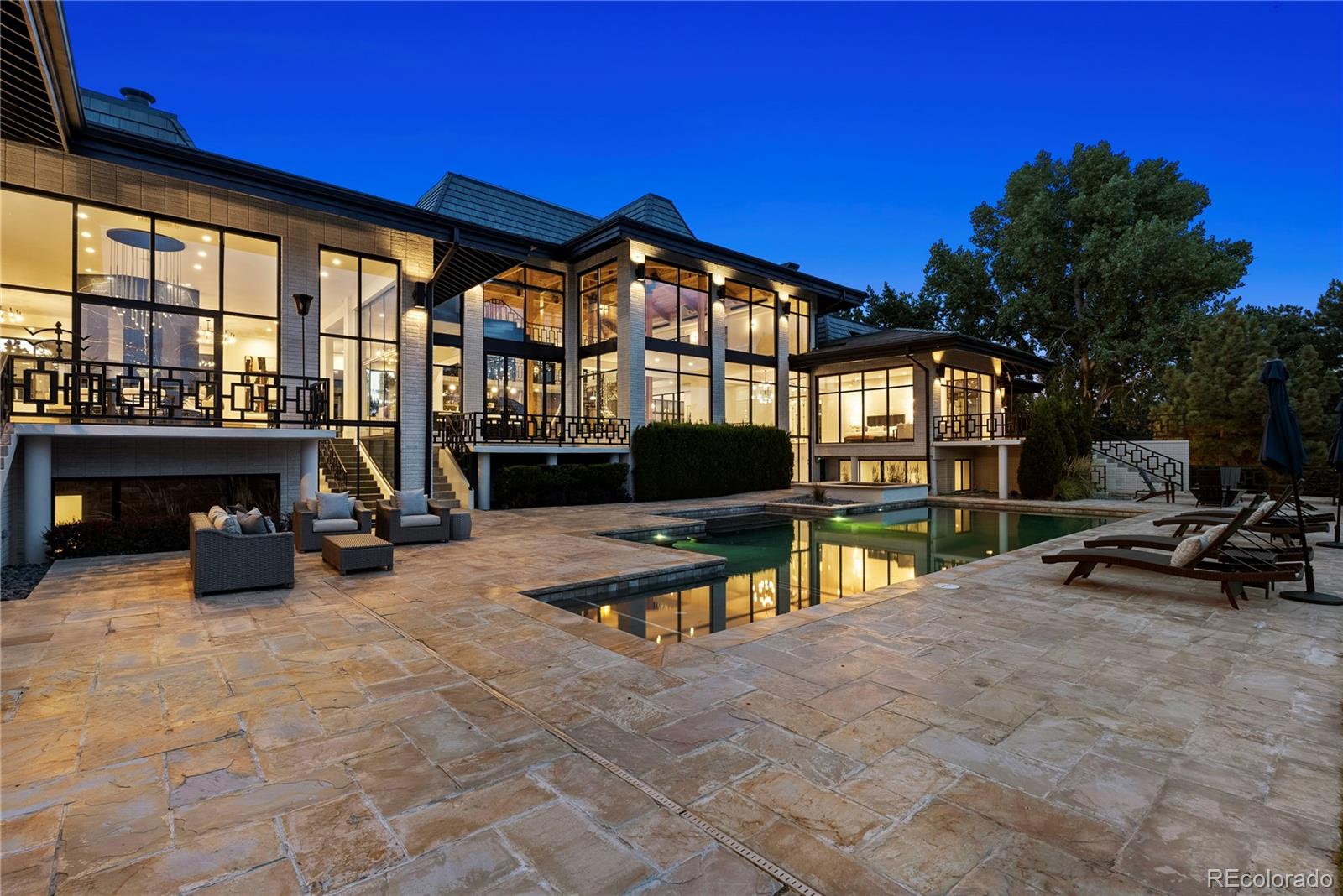 3962 South Chase Way Denver, CO 80235 - Photo 39 of 40 a view of pool with lawn chairs and a barbeque