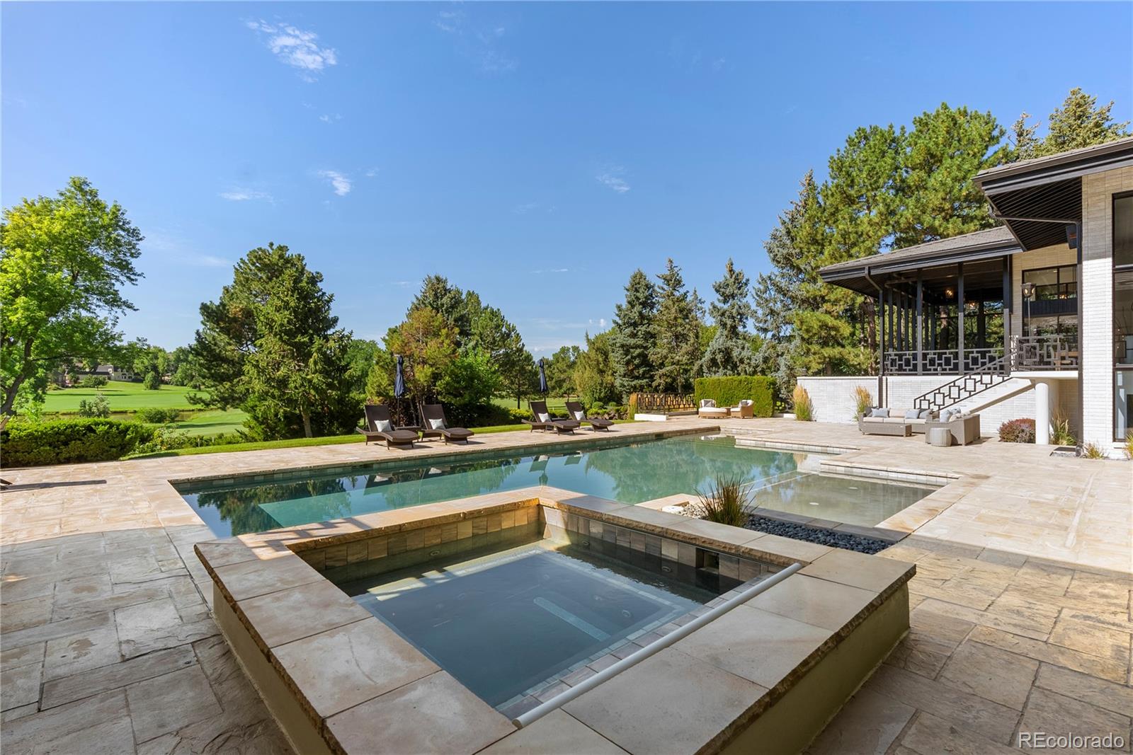 3962 South Chase Way Denver, CO 80235 - Photo 40 of 40 a view of a swimming pool with a patio