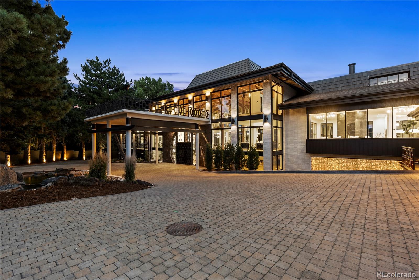 3962 South Chase Way Denver, CO 80235 - Photo 4 of 40 a front view of a house with a yard