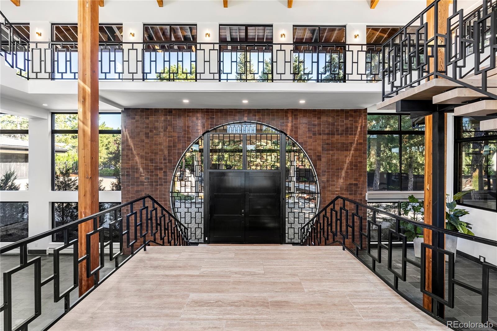 3962 South Chase Way Denver, CO 80235 - Photo 7 of 40 a view of a balcony with a lots of frames on deck