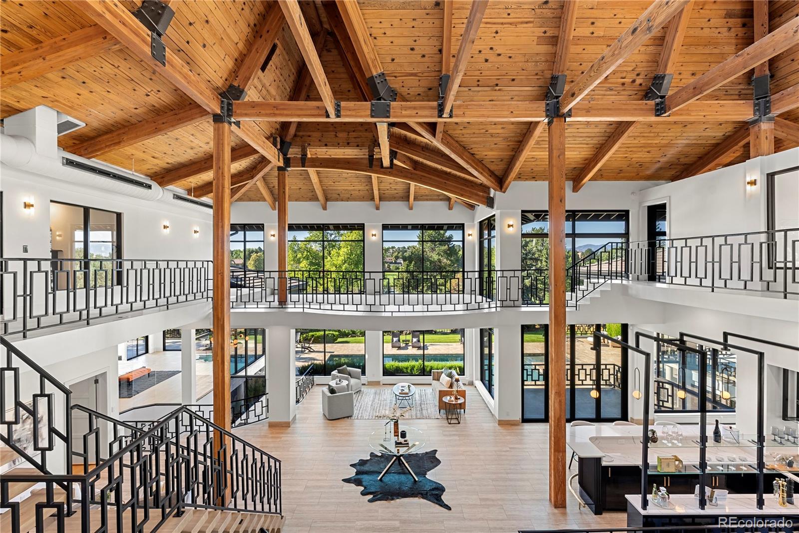 3962 South Chase Way Denver, CO 80235 - Photo 8 of 40 a roof deck with table and chairs