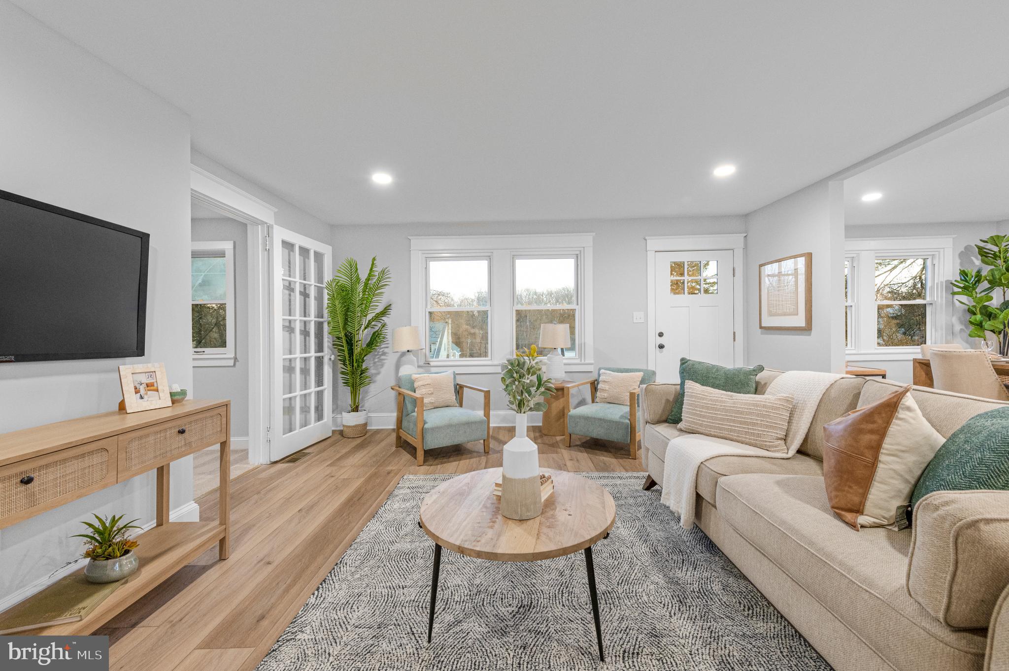 220 North Rolling Road Springfield, PA 19064 - Photo 11 of 41 a living room with furniture and a flat screen tv