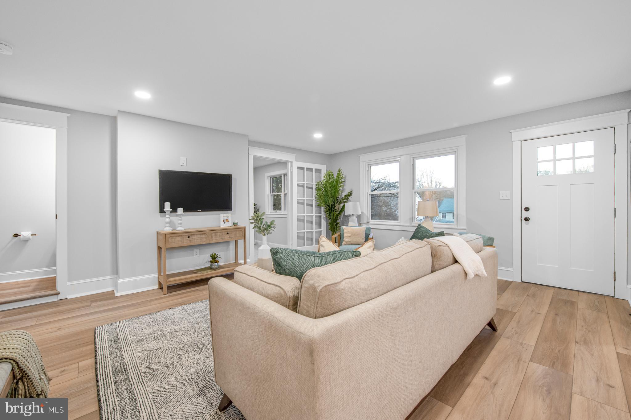 220 North Rolling Road Springfield, PA 19064 - Photo 13 of 41 a living room with furniture and a flat screen tv