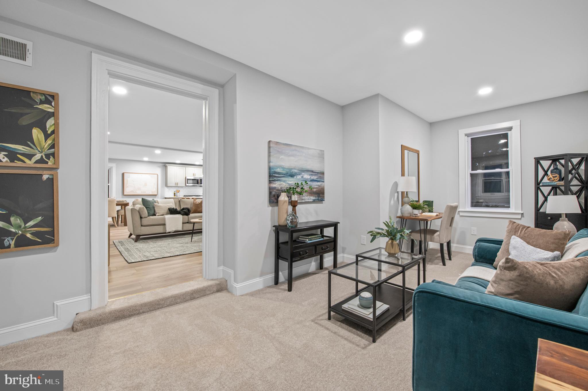 220 North Rolling Road Springfield, PA 19064 - Photo 15 of 41 a living room with furniture and a large window