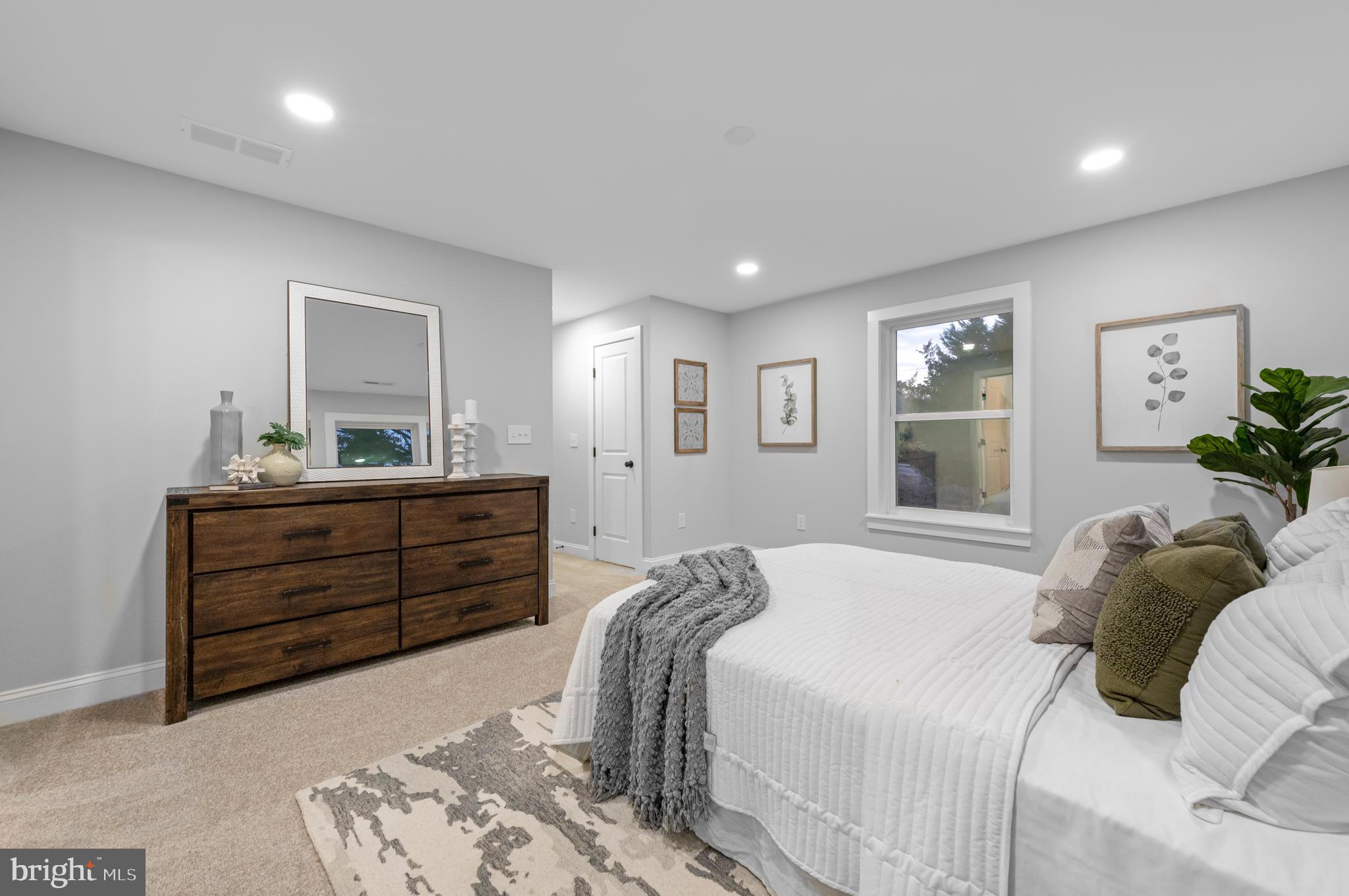 220 North Rolling Road Springfield, PA 19064 - Photo 26 of 41 a bedroom with a bed and a window