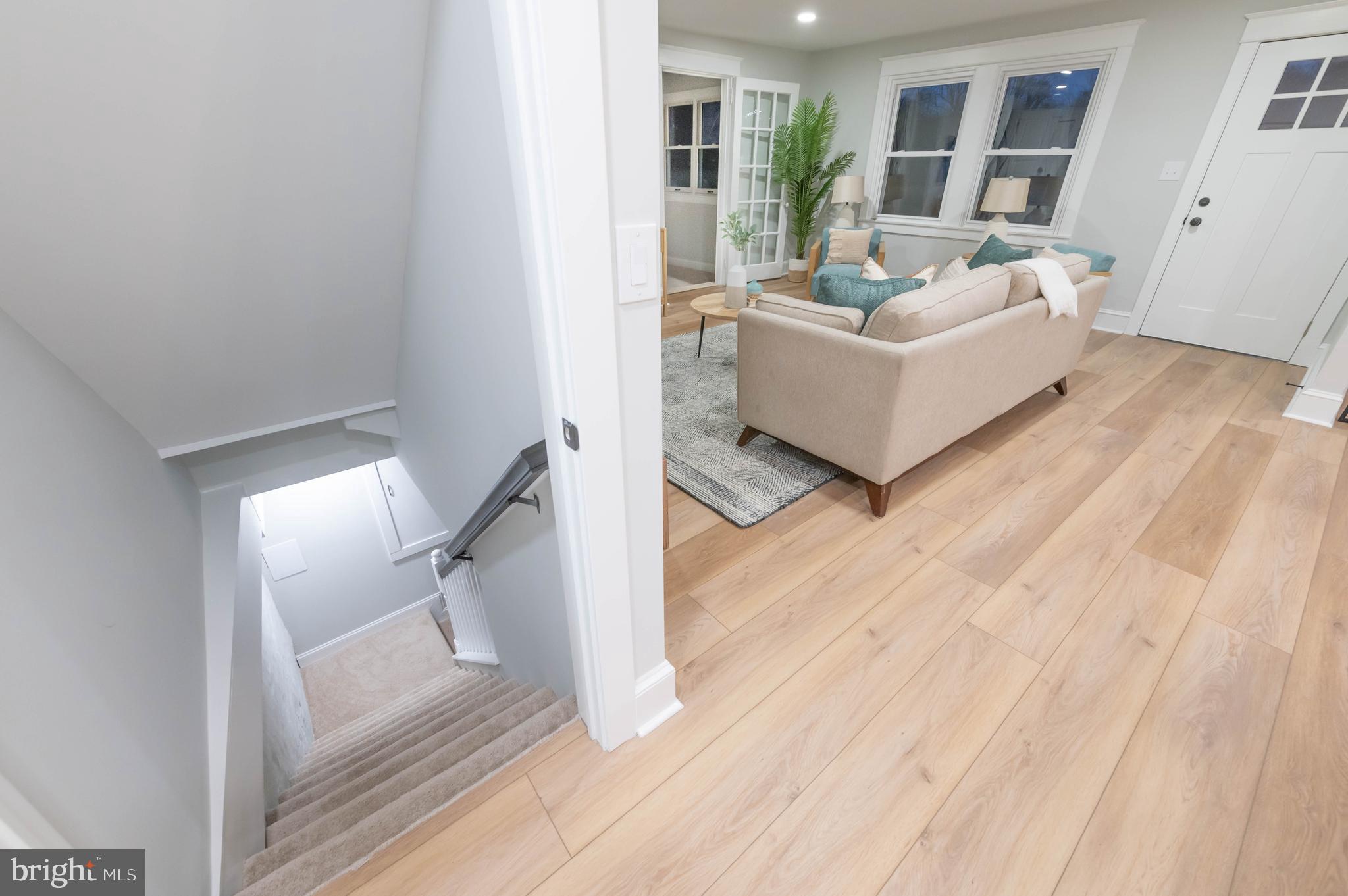 220 North Rolling Road Springfield, PA 19064 - Photo 30 of 41 a living room with furniture and a wooden floor