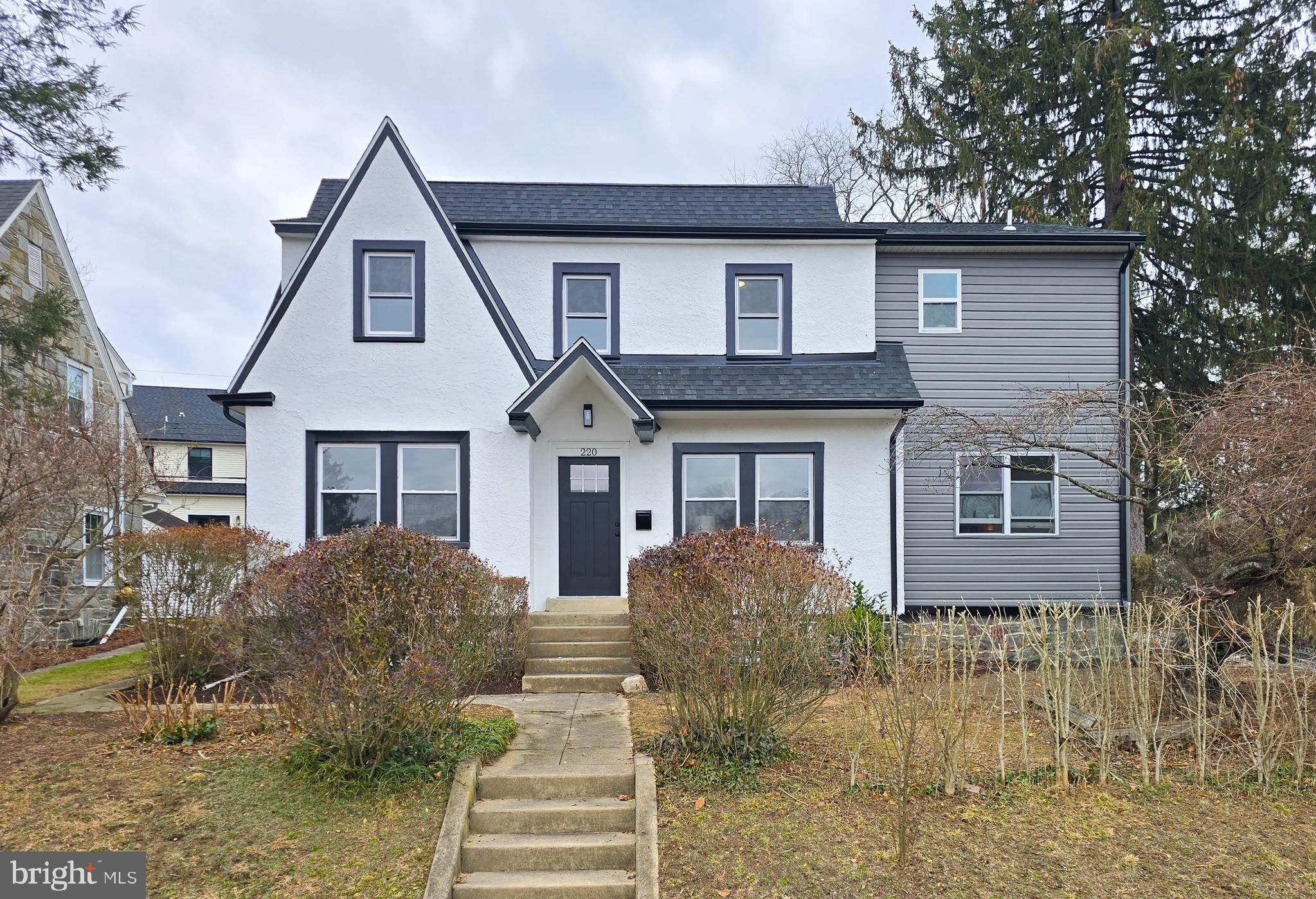 220 North Rolling Road Springfield, PA 19064 - Photo 37 of 41 a front view of a house with a yard