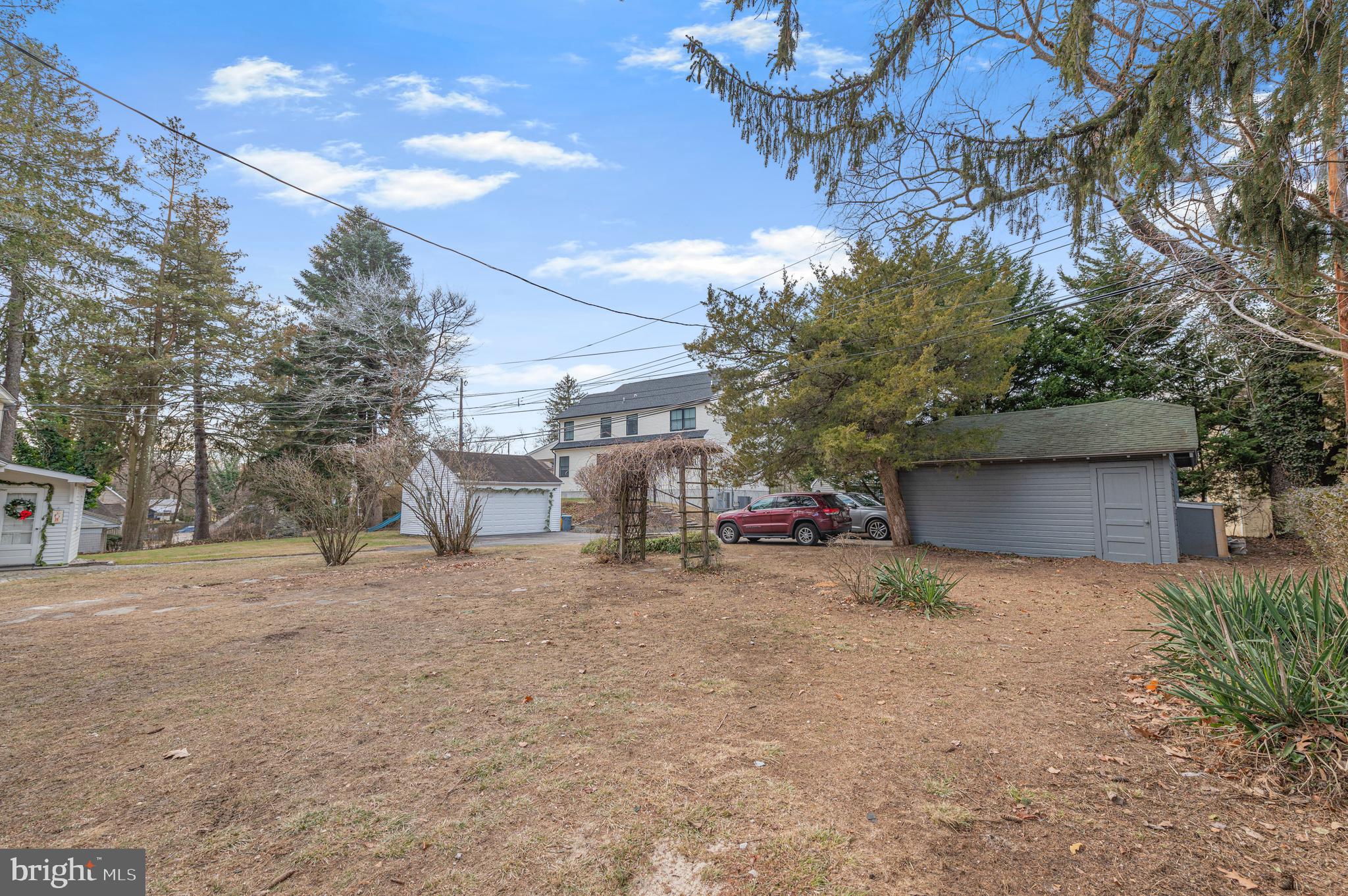220 North Rolling Road Springfield, PA 19064 - Photo 40 of 41 a view of a patio with a table and chairs under an umbrella