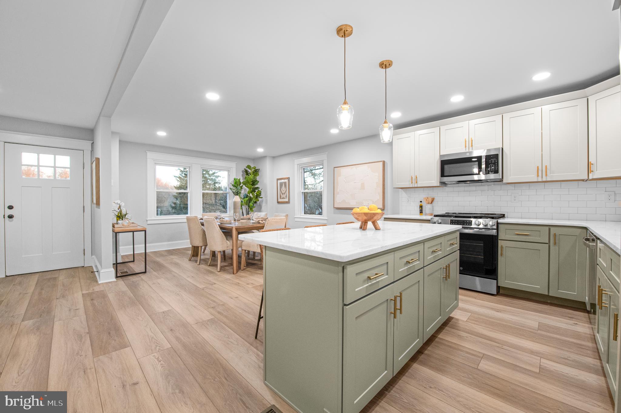 220 North Rolling Road Springfield, PA 19064 - Photo 8 of 41 a kitchen with a sink stove and cabinets