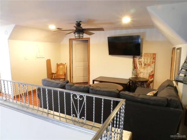 a bed room with a bed and a television