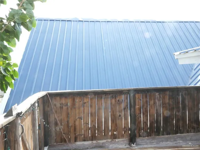 a view of backyard with patio