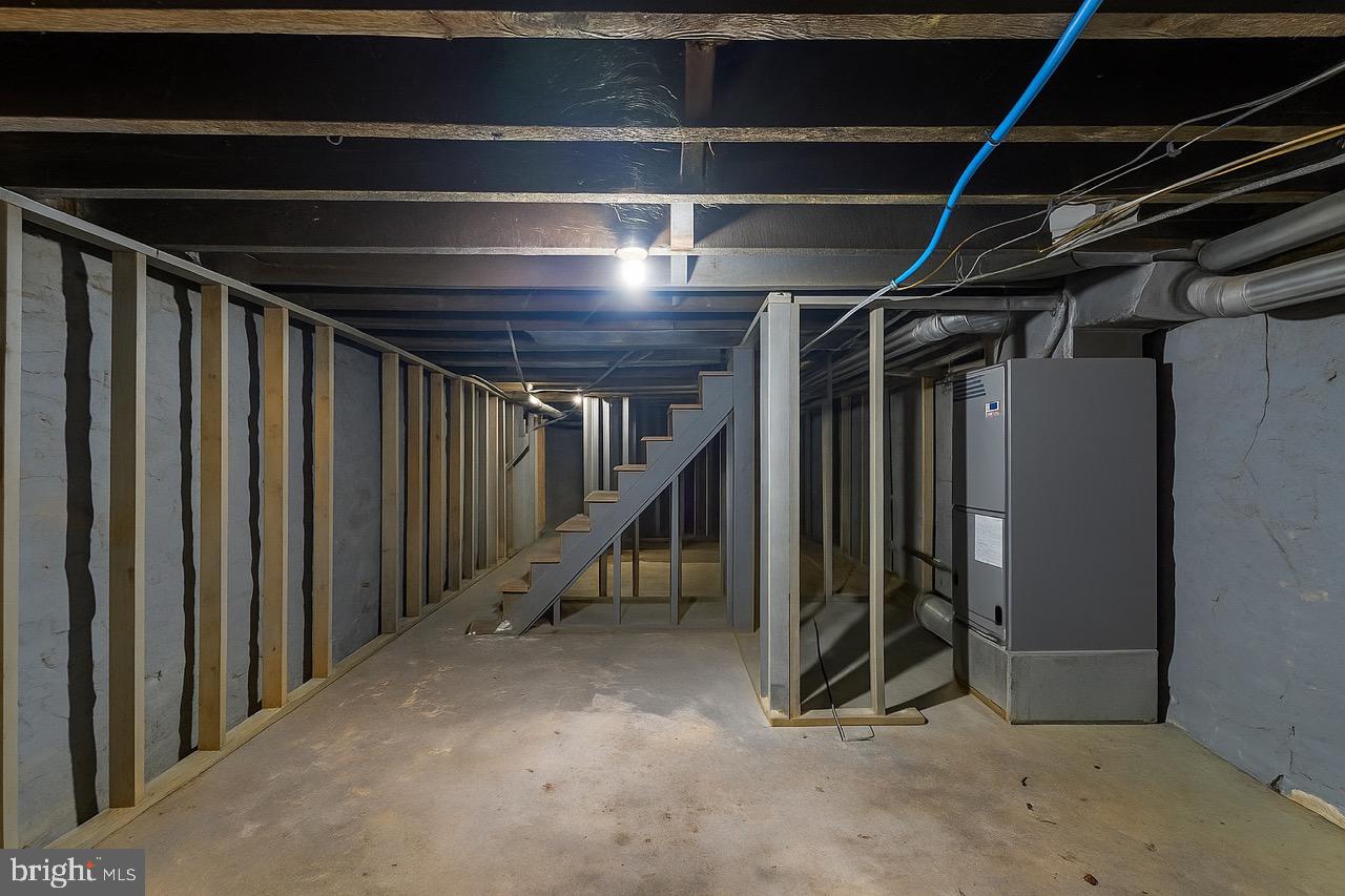 3207 Baker Street Baltimore, MD 21216 - Photo 12 of 14 a view of an empty room with wooden walls