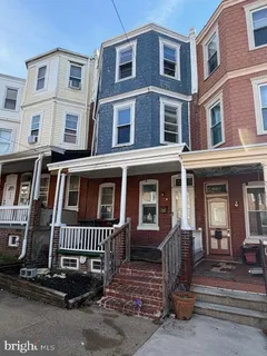 a front view of a house with a fence