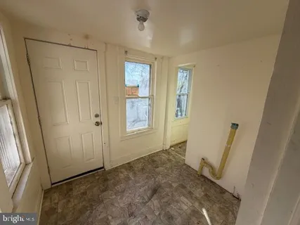 a view of entryway with window and stairs