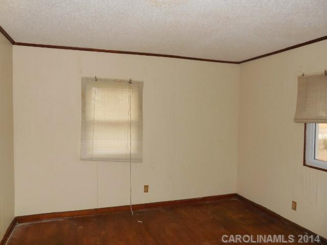 118 McKinley Road Springfield, SC 29146 - Photo 5 of 7 a view of a small space with wooden floor and a window