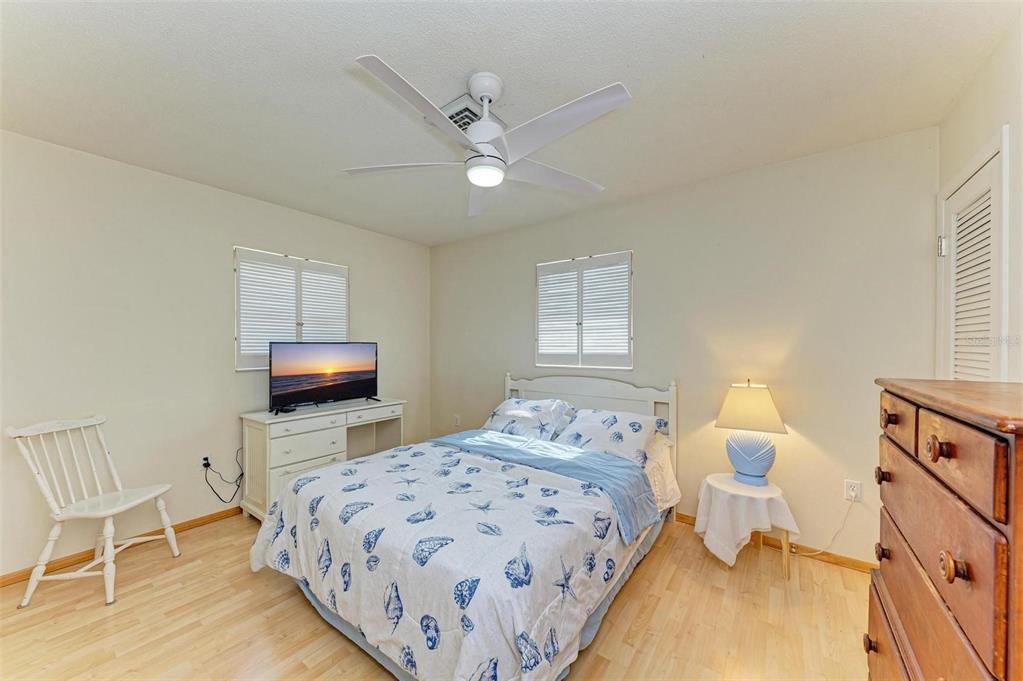 401 Shore Road Nokomis, FL 34275 - Photo 11 of 14 a bedroom with a bed and a tv on table