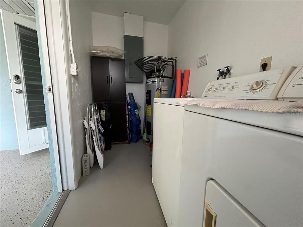 401 Shore Road Nokomis, FL 34275 - Photo 14 of 14 a storage room with washer and dryer