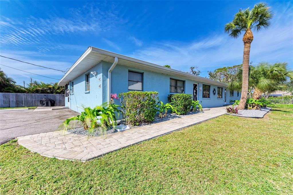 401 Shore Road Nokomis, FL 34275 - Photo 2 of 14 a front view of a house with a yard
