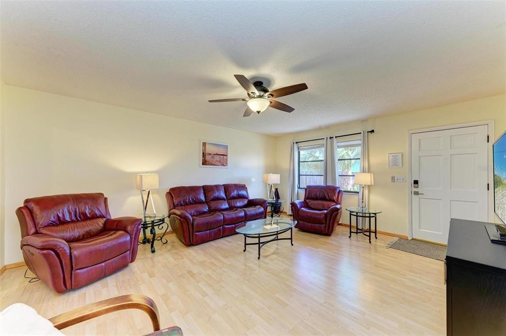 401 Shore Road Nokomis, FL 34275 - Photo 4 of 14 a living room with furniture or couch and a window