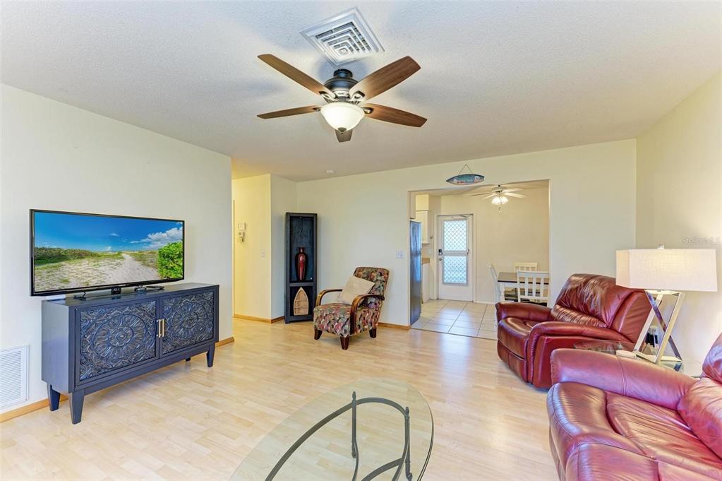 401 Shore Road Nokomis, FL 34275 - Photo 5 of 14 a living room with furniture and a flat screen tv