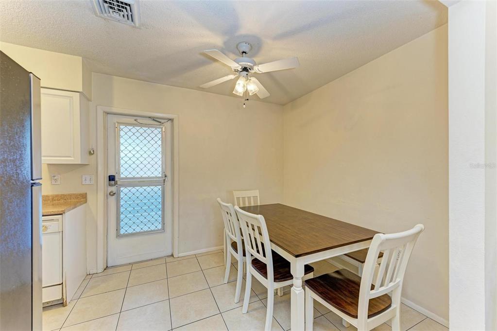 401 Shore Road Nokomis, FL 34275 - Photo 6 of 14 a view of a livingroom with furniture and chandelier fan