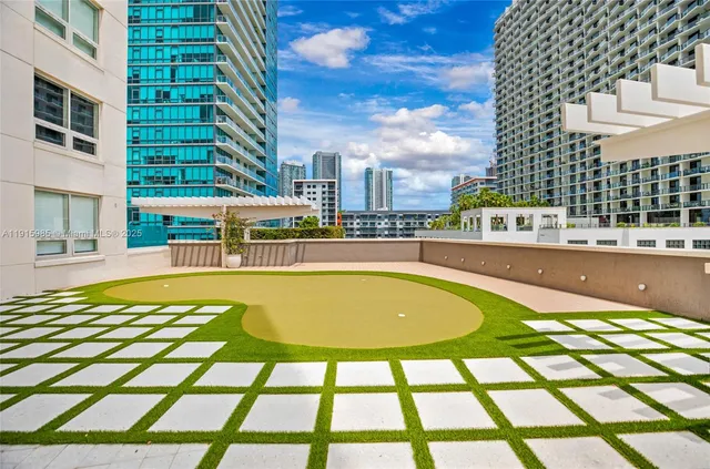 a view of a swimming pool with a seating space