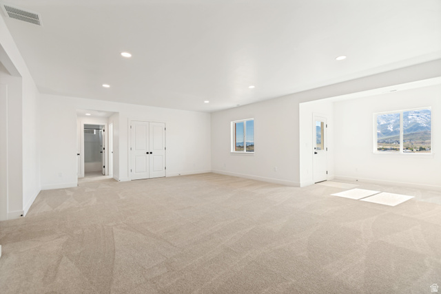 1351 Maple Circle Santaquin, UT 84655 - Photo 31 of 42 Spacious room featuring neutral carpeting, recessed lighting, and two windows offering mountain scenery